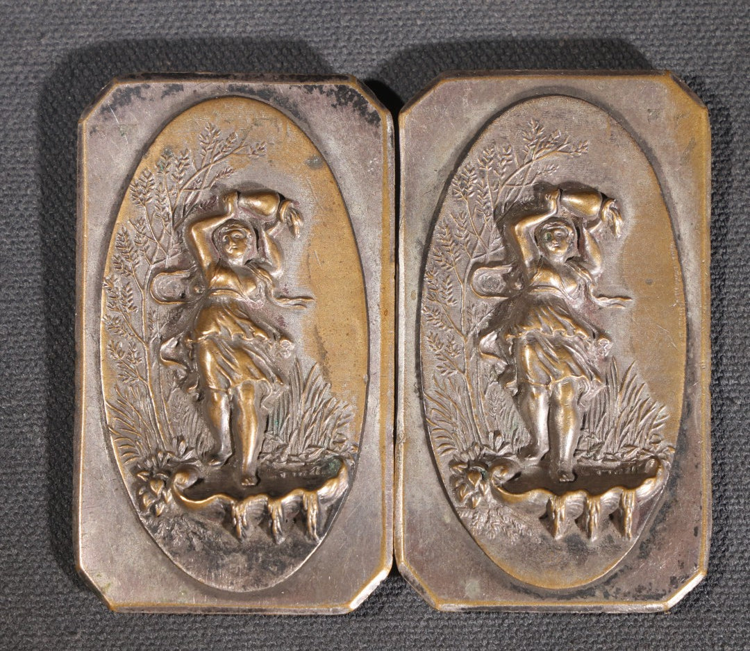 Lot 081 - Antique Silver-Plated Two-Piece Belt Buckle With Embossed Figural Woman Carrying Water Jug In Garden Setting