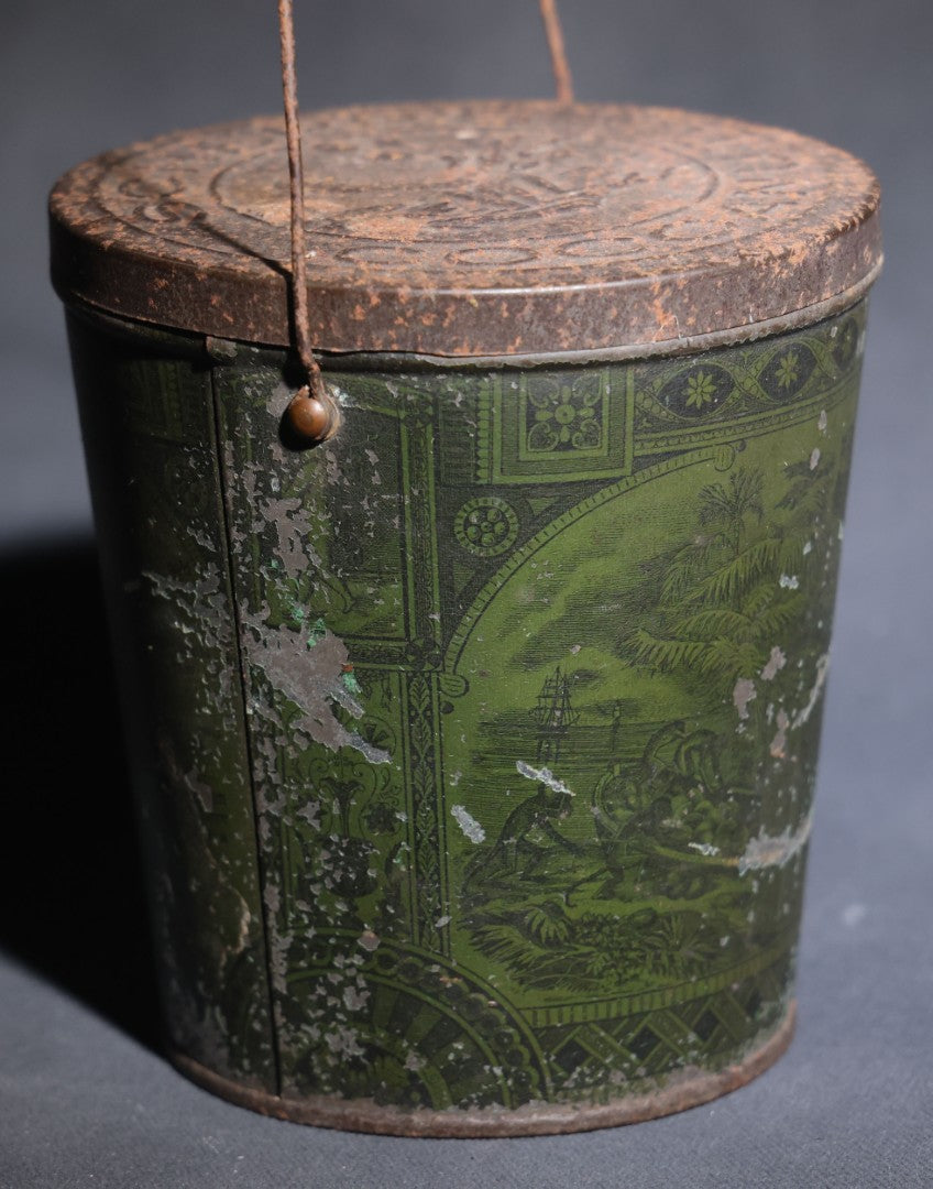 Lot 086 - Antique Schepp's Cocoanut Lithographed Tin Pail With Embossed Lid, Tropical Scene With Monkey, Palm Trees, And Sailing Ship, Note Graphic Loss
