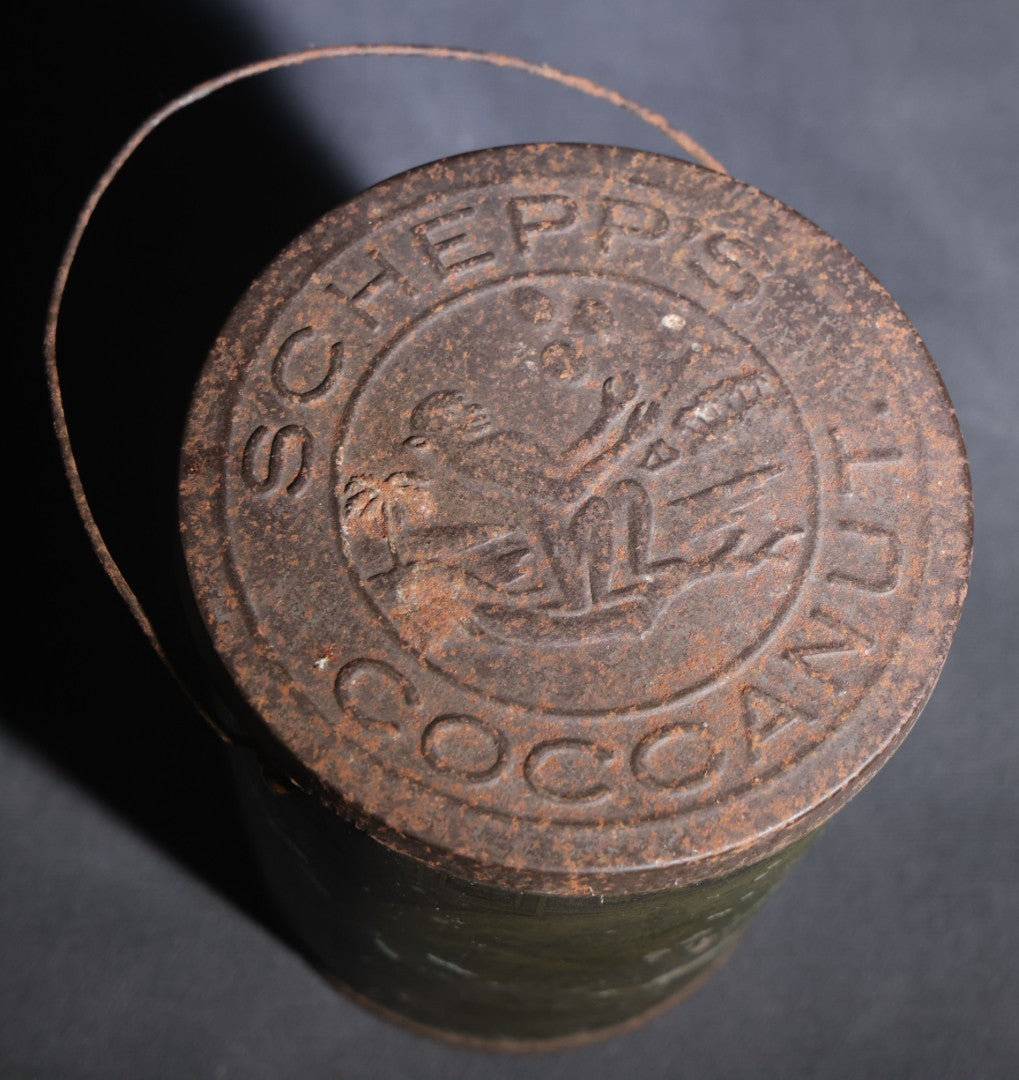 Lot 086 - Antique Schepp's Cocoanut Lithographed Tin Pail With Embossed Lid, Tropical Scene With Monkey, Palm Trees, And Sailing Ship, Note Graphic Loss
