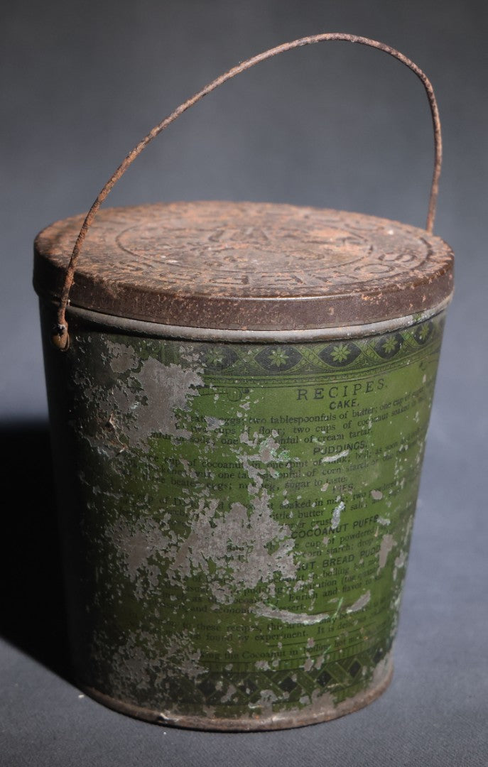 Lot 086 - Antique Schepp's Cocoanut Lithographed Tin Pail With Embossed Lid, Tropical Scene With Monkey, Palm Trees, And Sailing Ship, Note Graphic Loss