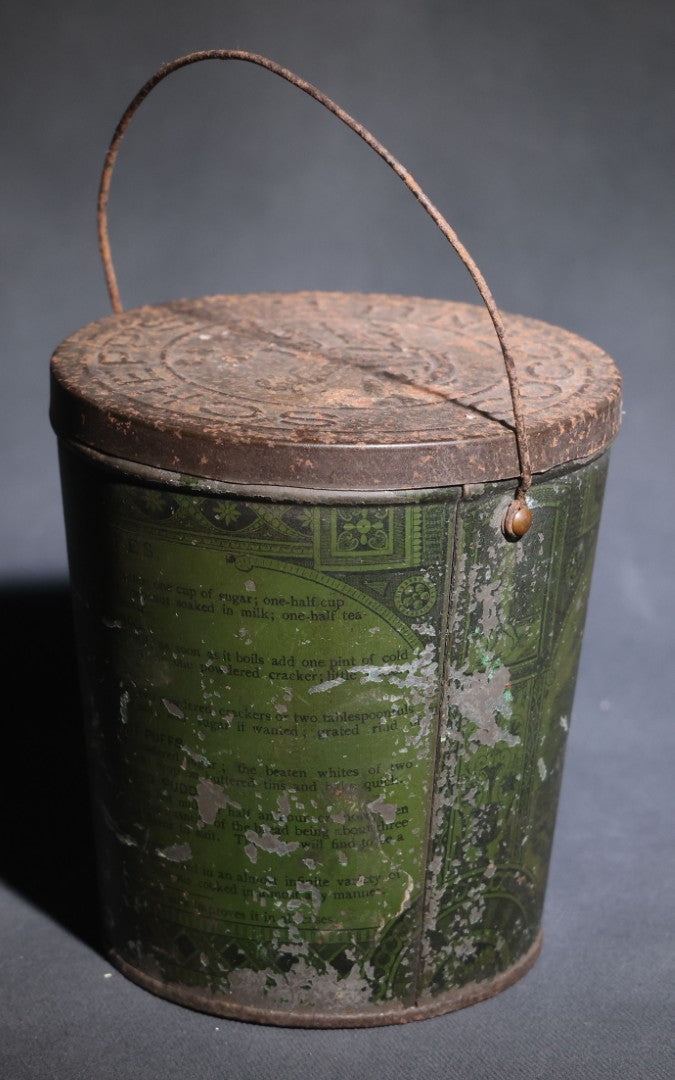 Lot 086 - Antique Schepp's Cocoanut Lithographed Tin Pail With Embossed Lid, Tropical Scene With Monkey, Palm Trees, And Sailing Ship, Note Graphic Loss