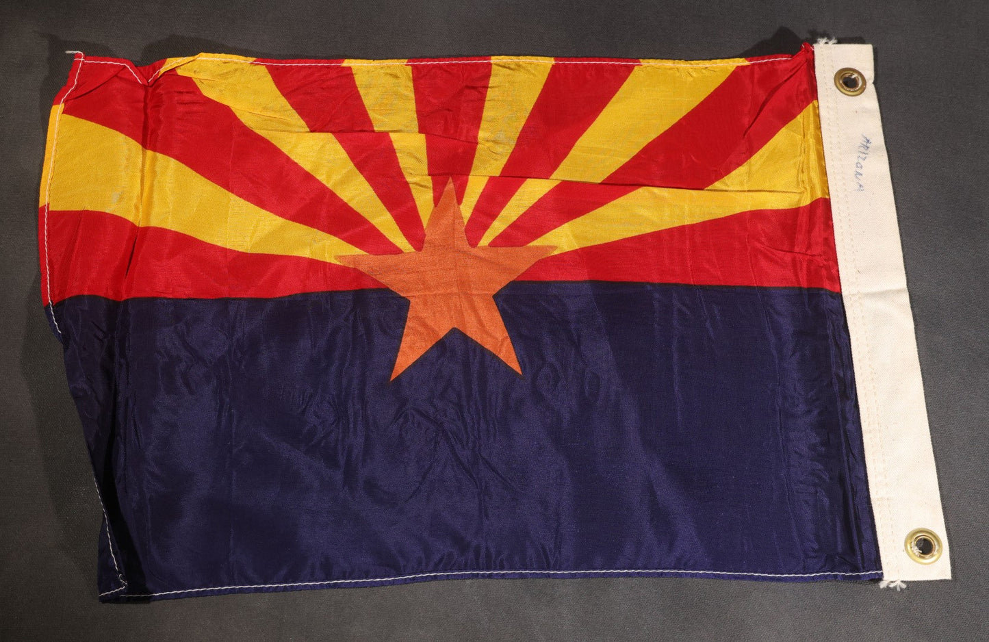 Lot 104 - Vintage Arizona State Flag, Red And Yellow Sunburst Rays With Copper Star On Blue Field, Grommeted Canvas Hoist