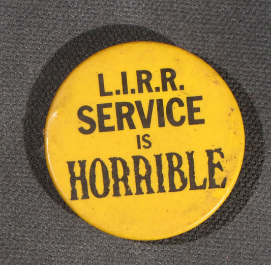 Lot 105 - Vintage "L.I.R.R. Service Is Horrible" Long Island Rail Road Protest Pinback Button, Yellow And Black