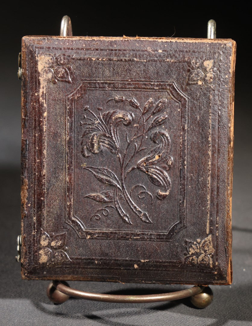 Lot 113 - Antique 1/6th Plate Daguerreotype Photograph, Half Split Leatherette Union Case With Embossed Floral Bouquet Design, Portrait Of A Middle-Aged Woman In Plaid Dress With Lace Collar, Holding Books