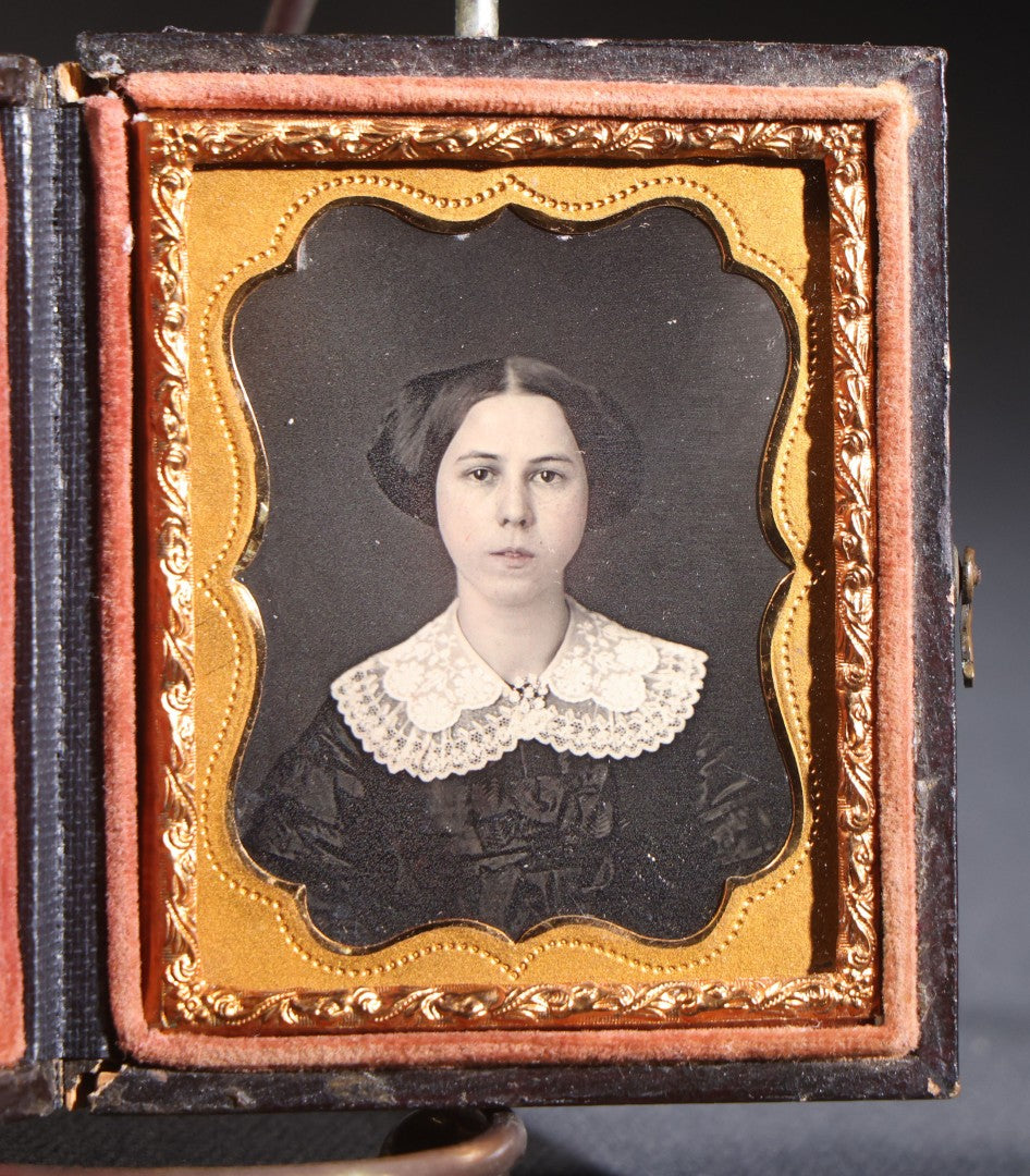 Lot 114 - Antique 1/9th Plate Daguerreotype Photograph, Full Intact Leatherette Union Case, Young Woman In Lace Collar And Dark Dress, Scroll And Medallion Design