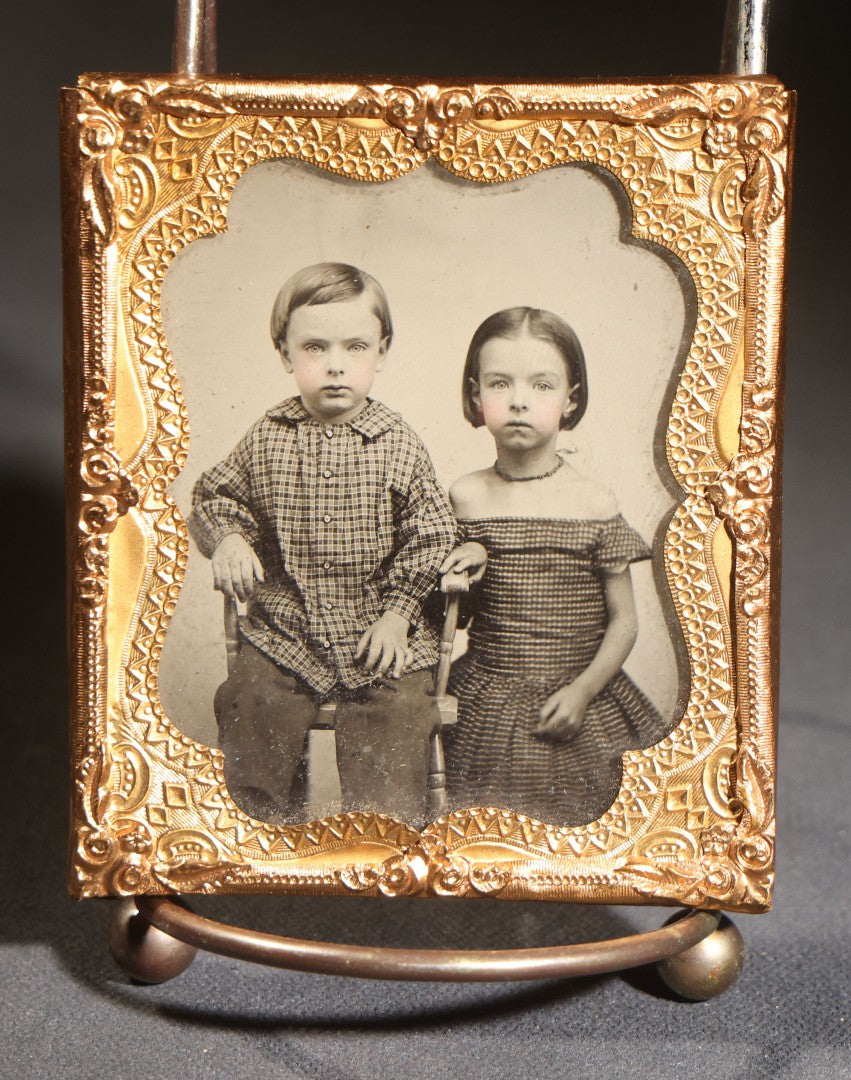 Lot 116 - Trio Of Antique Uncased Photograph Portraits Of Children, 1/6th Plate Ambrotype Of Siblings, 1/9th Plate Tintype Of A Seated Young Girl, And 1/6th Plate Ruby Ambrotype Of A Standing Young Girl, Ornate Brass Mats