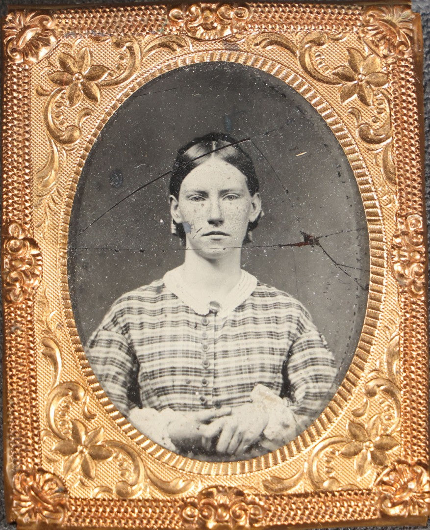 Lot 118 - Antique 1/9th Plate Ambrotype Photograph, Uncased, Portrait Of A Young Woman In Plaid Dress With White Collar, Photographed At Geo. L. Brakenridge's Ambrotype & Photograph Saloon, Ware, Massachusetts, Note Cracked Image Plate