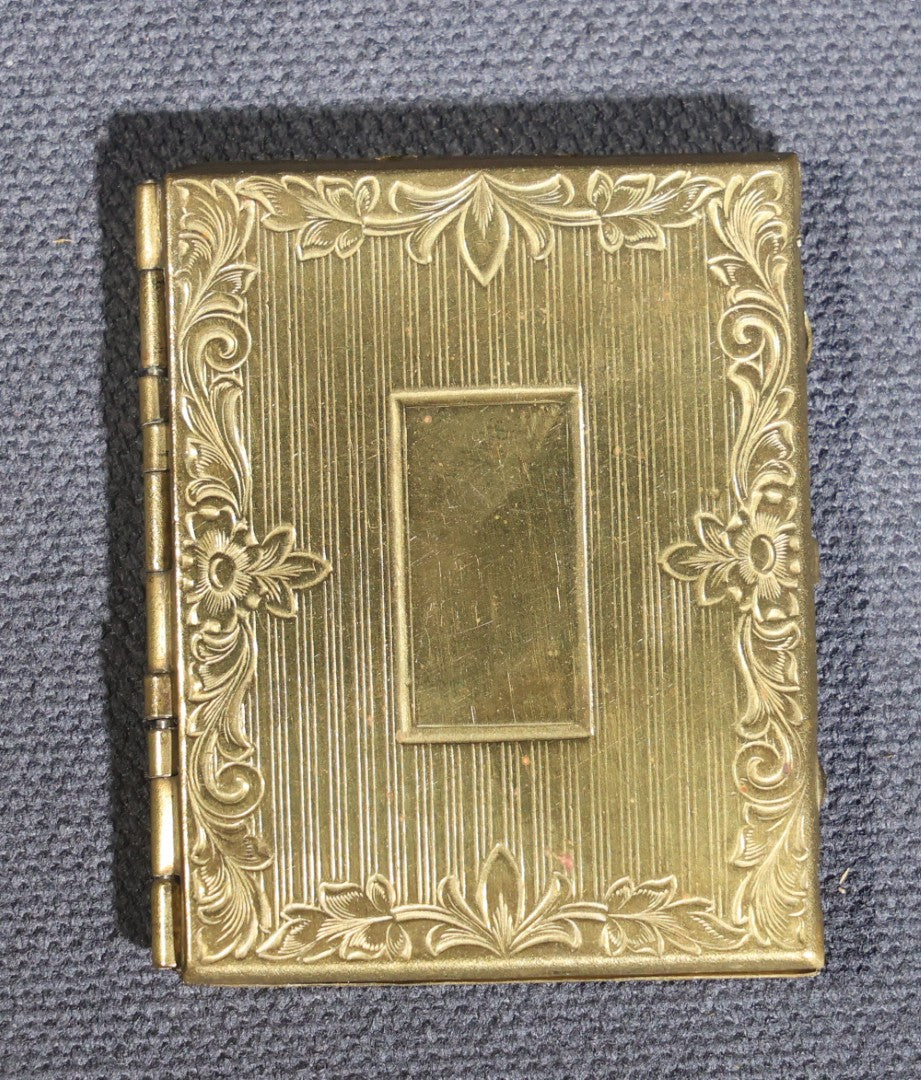 Lot 119 - Antique Tintype Photograph In Brass Book-Form Locket Case, Elderly Woman In Dark Dress, Engraved Floral And Scroll Design