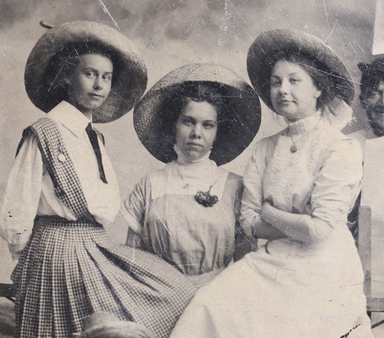 Lot 120 - Antique Tintype Photograph Of Five Young Women In Wide-Brimmed Hats With Parasols, Man Peeking Through Hole In Studio Backdrop, Seaside Scene