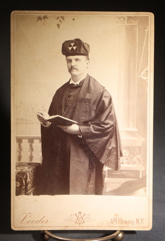 Lot 126 - Antique Cabinet Card Photograph Of A Middle-Aged Man In Dark Ceremonial Robe With Black Cross, Cap Bearing Cross-And-Triangle Devices, Holding A Book, Photographed By Veeder, Albany, New York