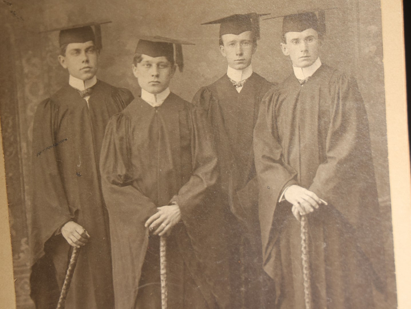 Lot 127 - Antique Board-Mounted Cabinet Card Photograph Of Four Young Men In Academic Graduation Robes And Mortarboards Holding Canes, Graduates At Dartmouth, Photographed By Langill, Hanover, New Hampshire