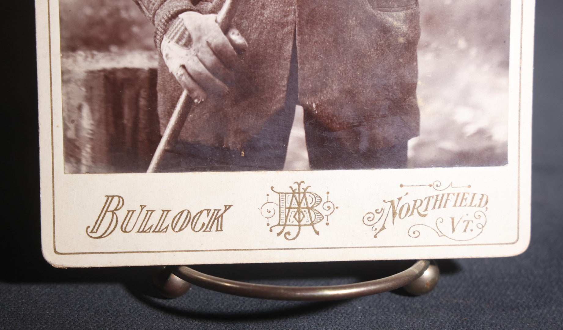 Lot 134 - Antique Cabinet Card Photograph Of A Rugged New England Man In Heavy Coat, Cap, Gloves, And Scarf Holding A Walking Stick, Ink-Inscribed "Joel Simons," Photographed By Bullock, Northfield, Vermont