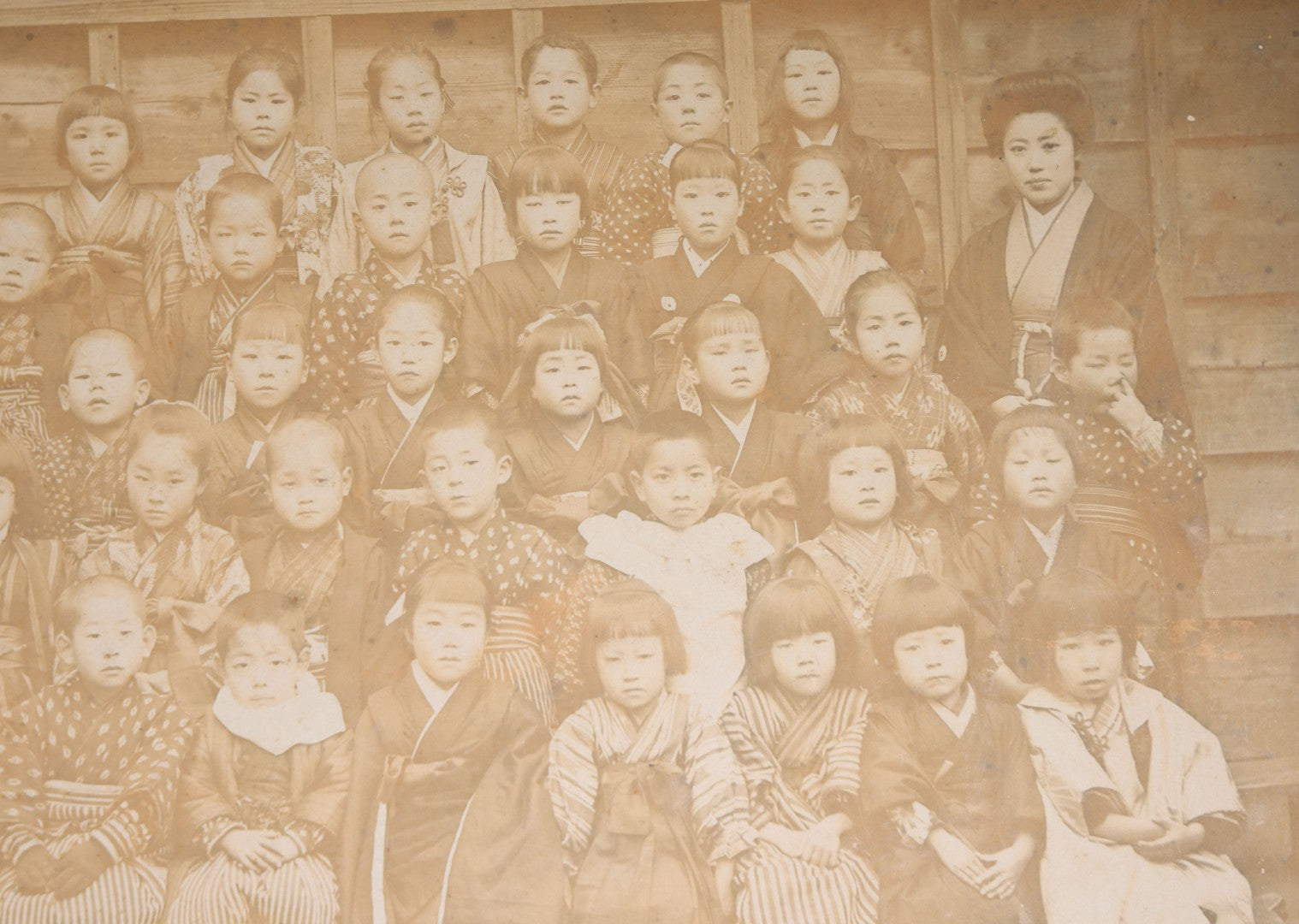 Lot 139 - Antique Board-Mounted Photograph Of Japanese Children In Kimono With Their Teacher, One Child Picking His Nose, Photographed By N. Ohashi