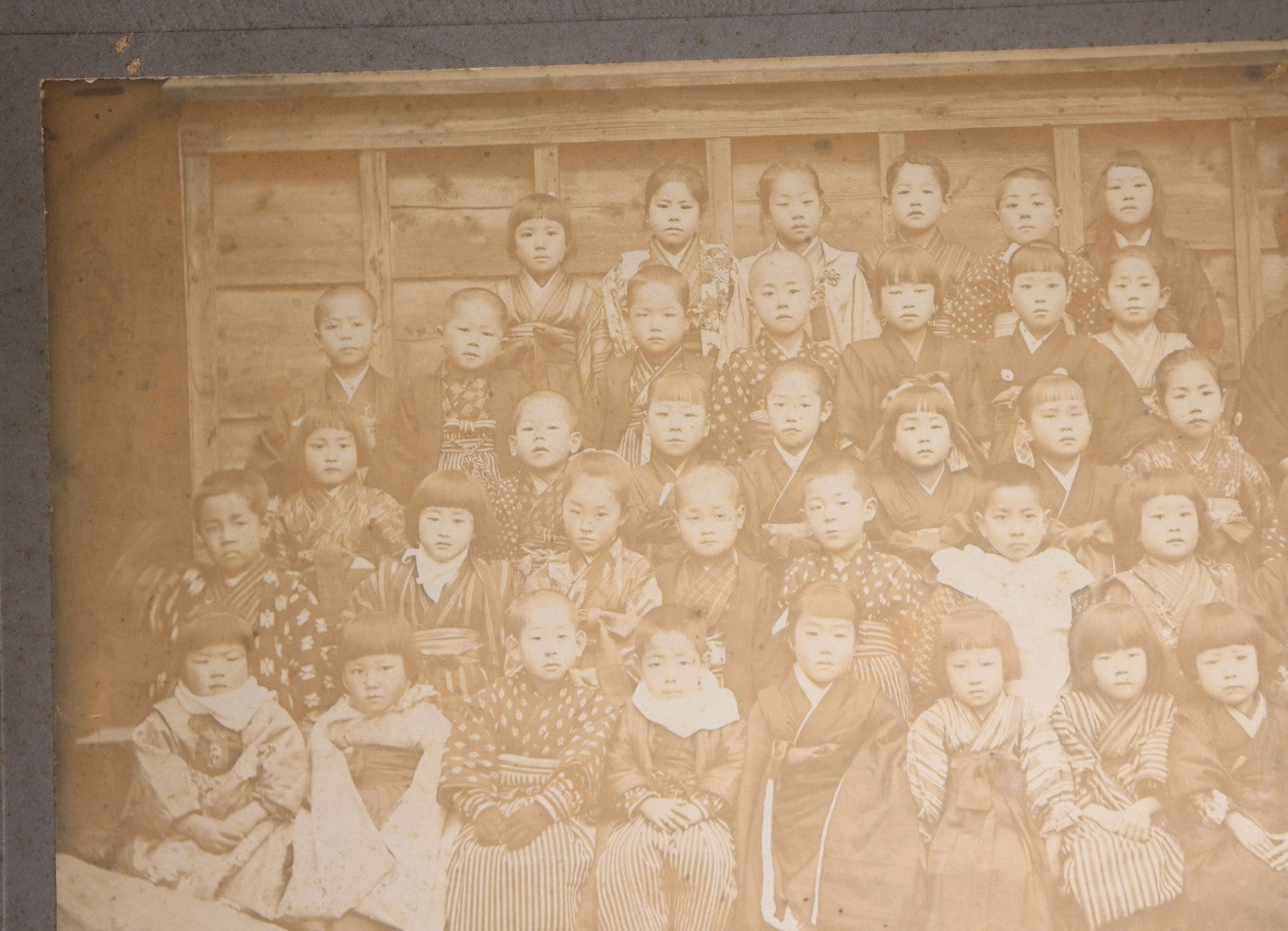 Lot 139 - Antique Board-Mounted Photograph Of Japanese Children In Kimono With Their Teacher, One Child Picking His Nose, Photographed By N. Ohashi
