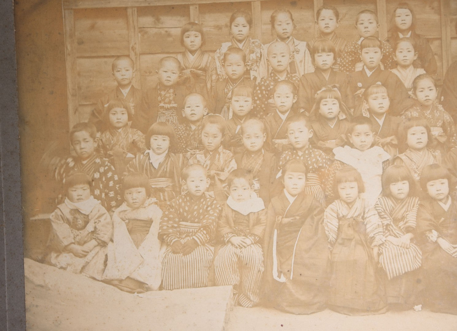 Lot 139 - Antique Board-Mounted Photograph Of Japanese Children In Kimono With Their Teacher, One Child Picking His Nose, Photographed By N. Ohashi