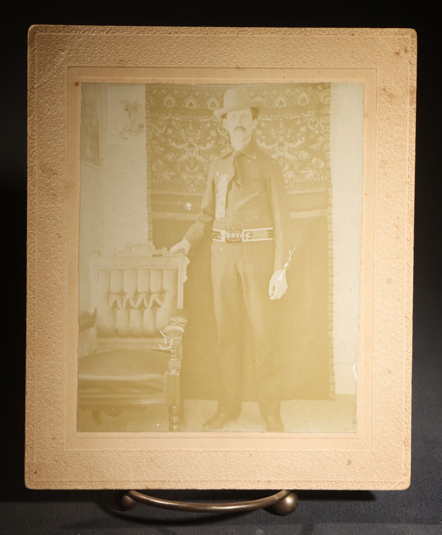 Lot 143 - Antique Board-Mounted Photograph Of A Man In Western Dress With Cowboy Hat, Decorative Shirt, And Fraternal Ribbon Badge With Eagle Device, "Bbv" Belt Buckle