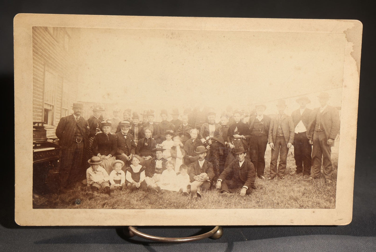 Lot 144 - Grouping Of Seven Antique Board-Mounted Photographs Of Outdoor Group Gatherings, Including Large Hillside Assembly, Men's Outing With Bottles And Basket, And Men In Aprons