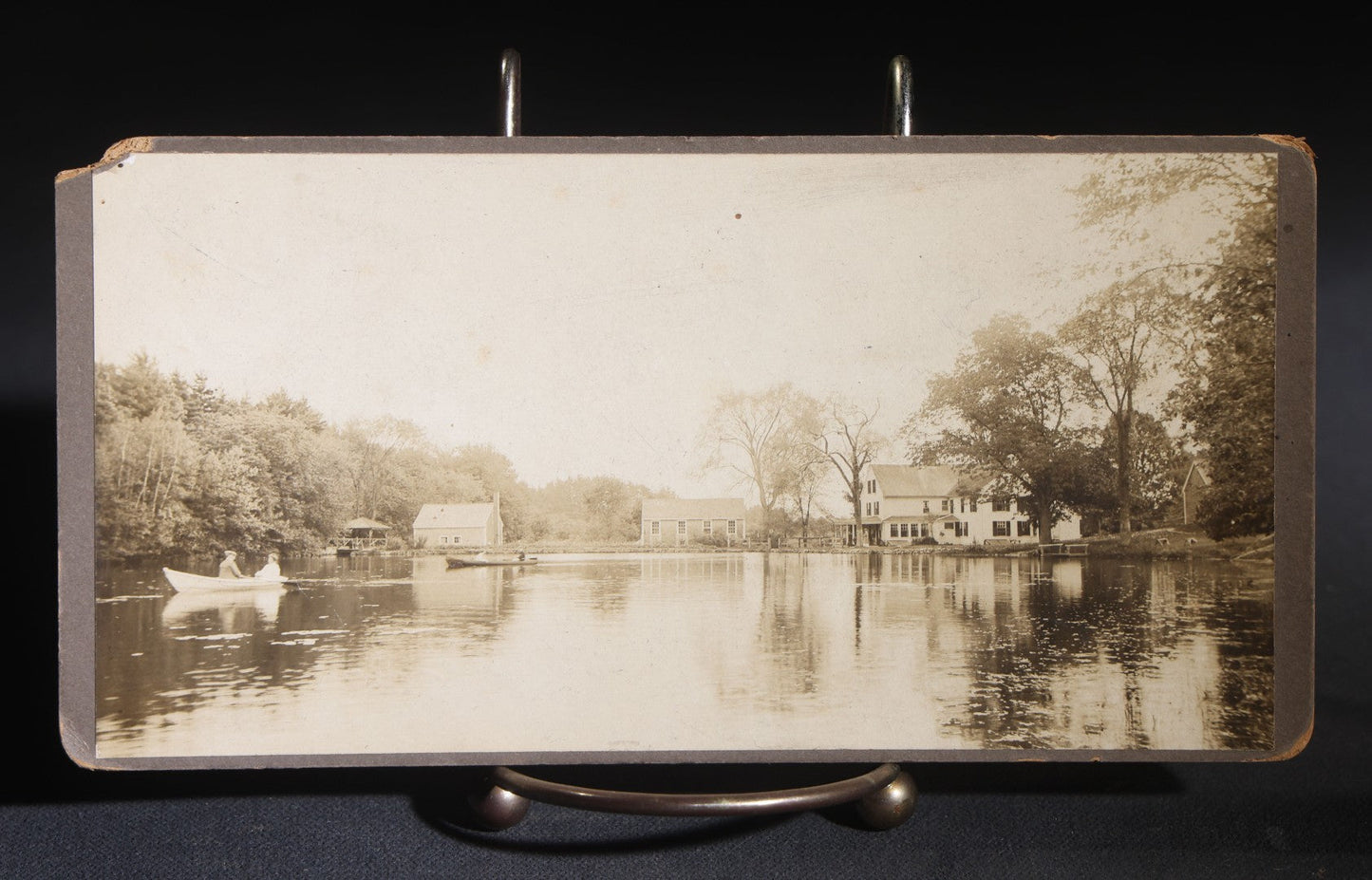 Lot 147 - Pair Of Antique Board-Mounted Panoramic Photographs, New England Pond With Rowboat And Houses, And Bearded Man With Horse And Buggy At Mailbox