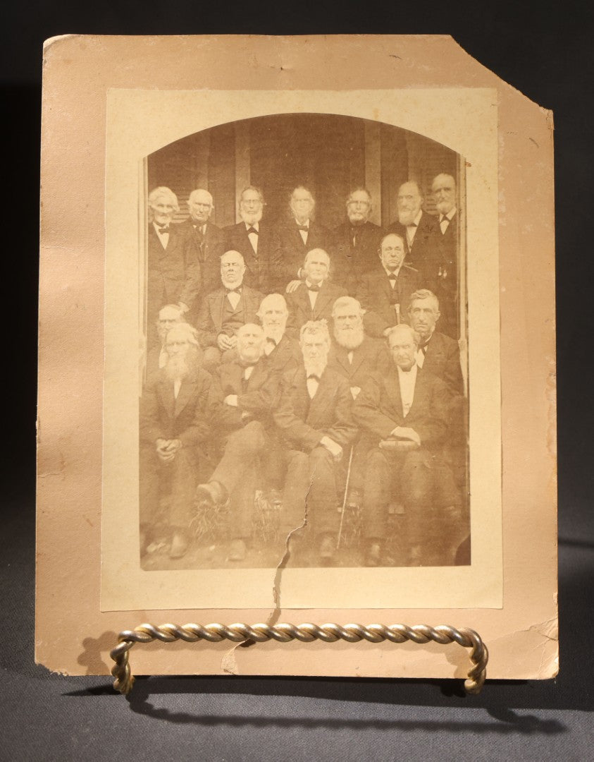 Lot 151 - Trio Of Antique Board-Mounted Group Photographs Including Large Gathering With American And British Flags At Arched Pavilion, Elderly Men In Formal Dress, And Generational Family Studio Portrait