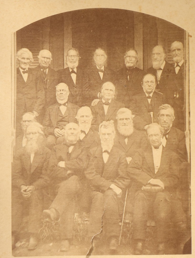 Lot 151 - Trio Of Antique Board-Mounted Group Photographs Including Large Gathering With American And British Flags At Arched Pavilion, Elderly Men In Formal Dress, And Generational Family Studio Portrait