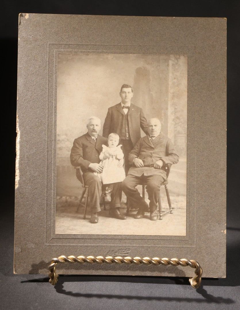 Lot 151 - Trio Of Antique Board-Mounted Group Photographs Including Large Gathering With American And British Flags At Arched Pavilion, Elderly Men In Formal Dress, And Generational Family Studio Portrait