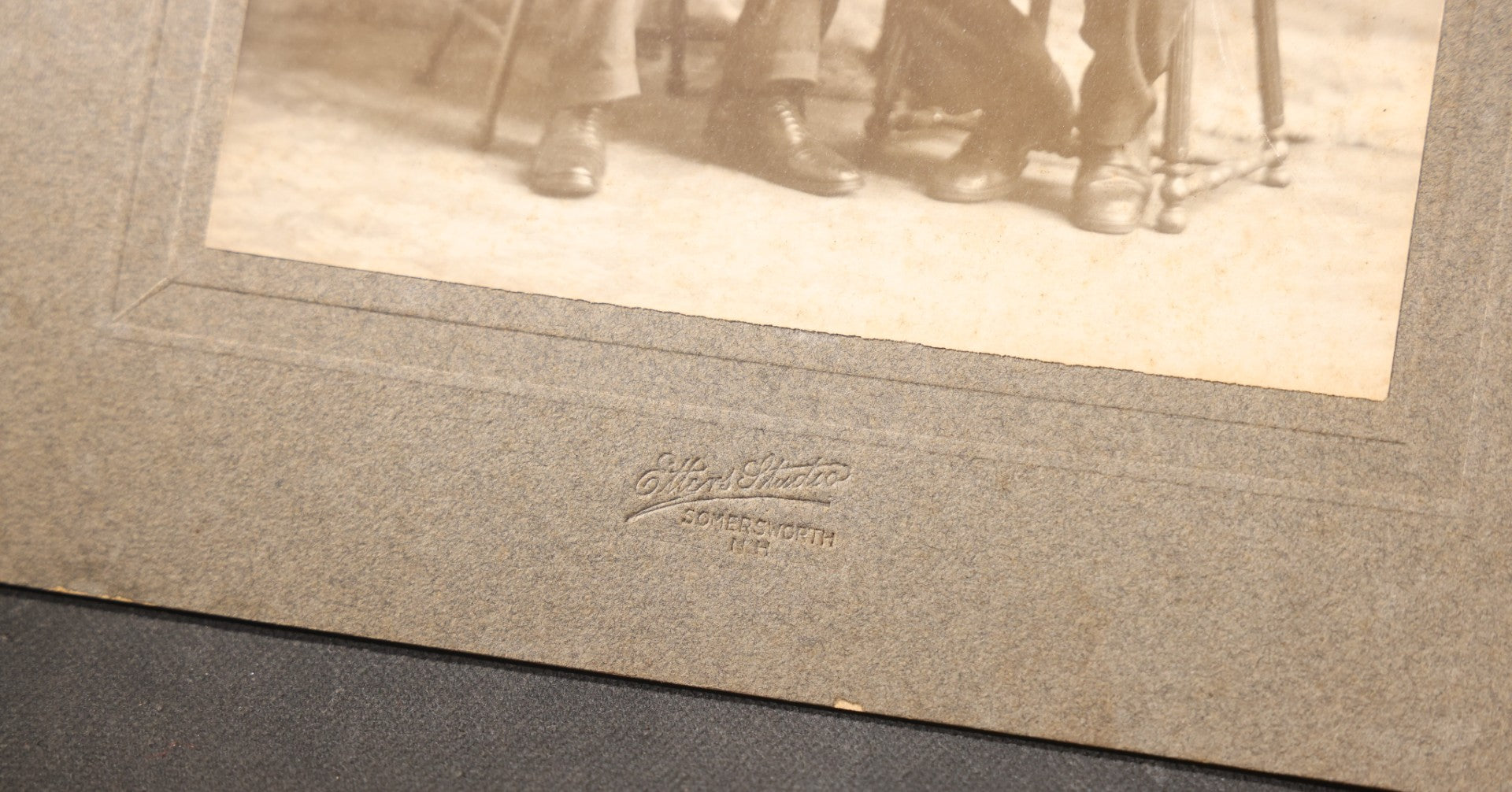 Lot 151 - Trio Of Antique Board-Mounted Group Photographs Including Large Gathering With American And British Flags At Arched Pavilion, Elderly Men In Formal Dress, And Generational Family Studio Portrait