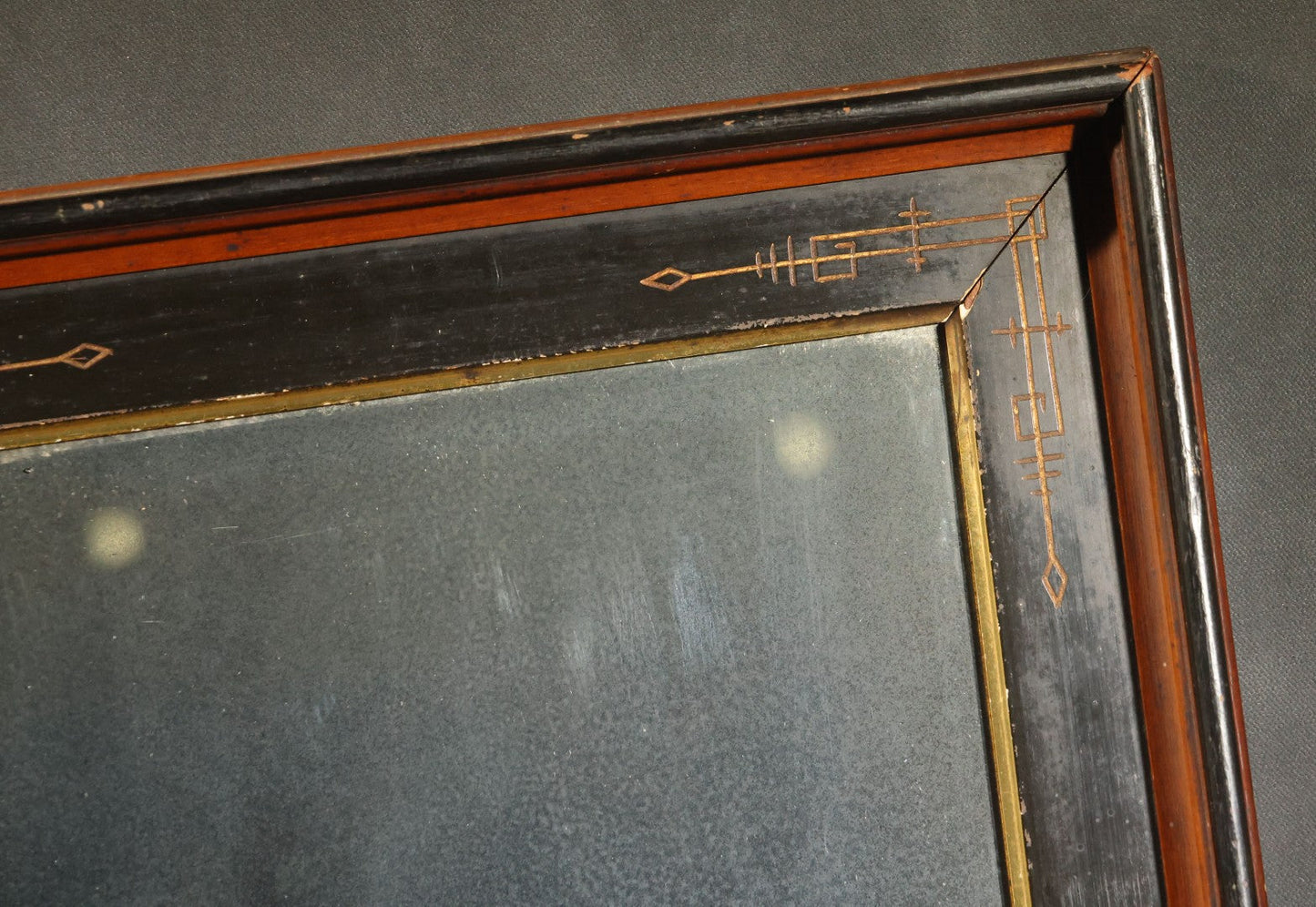Antique Eastlake-Style Ebonized and Walnut Framed Mirror with Gilt Incised Geometric Decoration, Replacement Mirror Plate