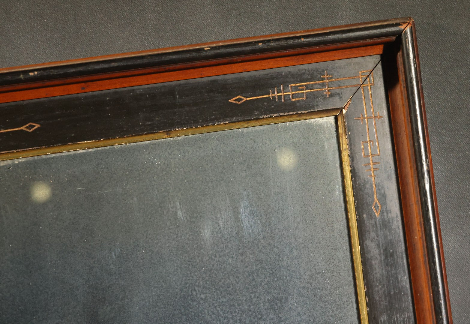 Antique Eastlake-Style Ebonized and Walnut Framed Mirror with Gilt Incised Geometric Decoration, Replacement Mirror Plate
