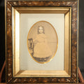 Lot 013 - Antique Photograph of a Young Girl in a White Dress, Matted with Oval Gilt Opening, in Ebonized Inlaid Frame, 12-1/8" W x 14-1/8" H