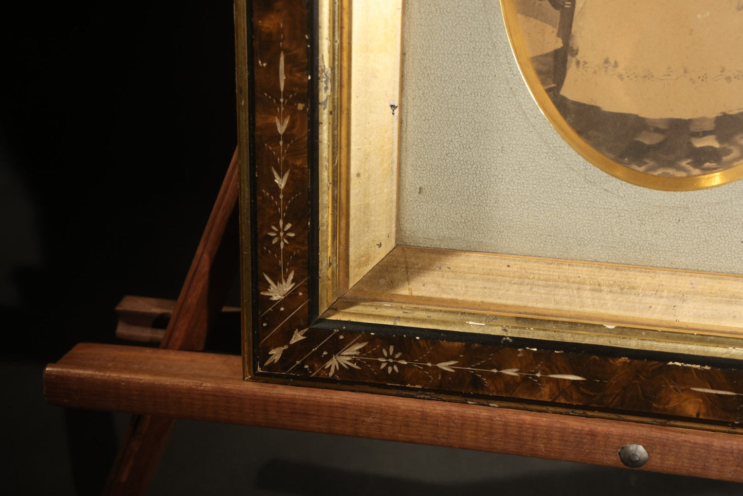 Antique Photograph of a Young Girl in a White Dress, Matted with Oval Gilt Opening, in Ebonized Inlaid Frame