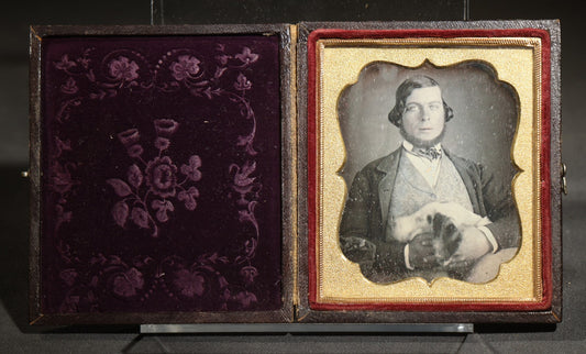 Antique 1/6th Plate Daguerreotype Photograph of a Young Man Hugging His Dog, in Full Leatherette Union Case with Figural Woman and Scrollwork Cover