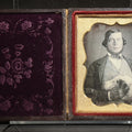 Lot 025 - Antique 1/6th Plate Daguerreotype Photograph of a Young Man Hugging His Dog, in Full Leatherette Union Case with Figural Woman and Scrollwork Cover