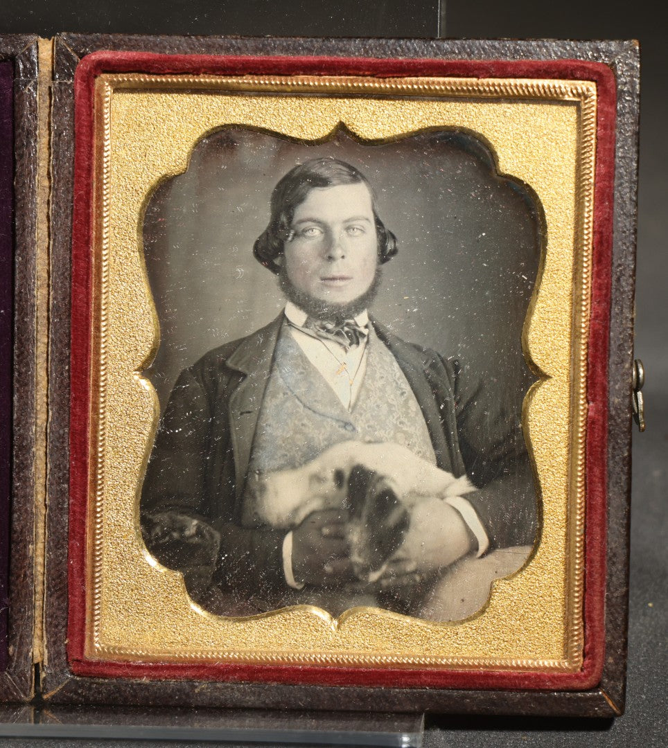 Antique 1/6th Plate Daguerreotype Photograph of a Young Man Hugging His Dog, in Full Leatherette Union Case with Figural Woman and Scrollwork Cover