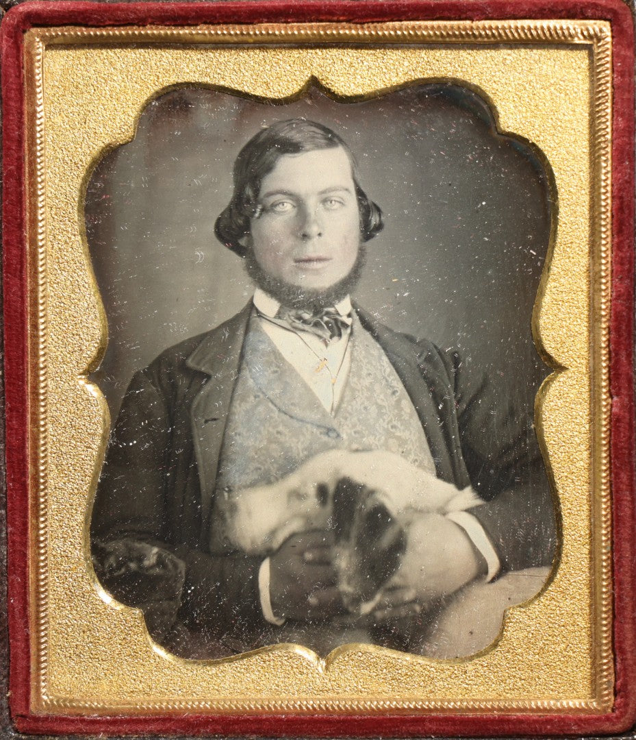 Antique 1/6th Plate Daguerreotype Photograph of a Young Man Hugging His Dog, in Full Leatherette Union Case with Figural Woman and Scrollwork Cover