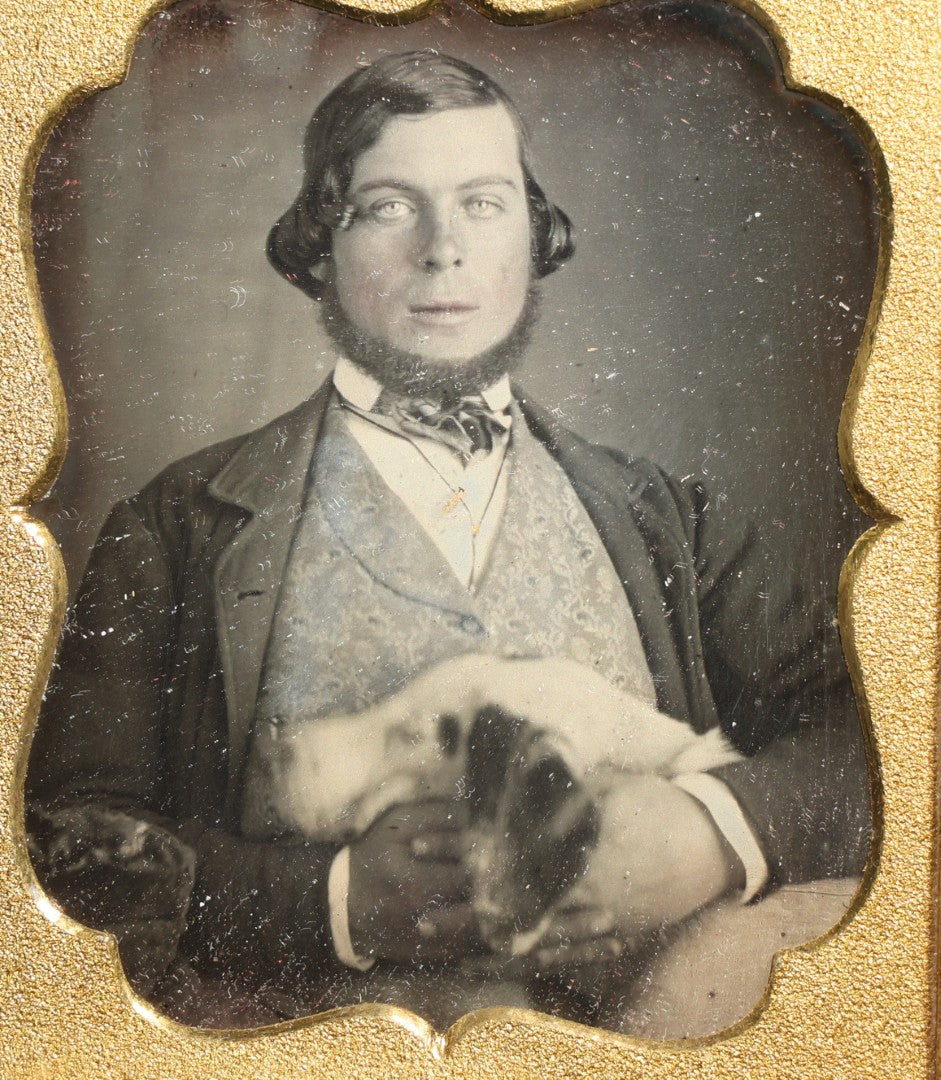 Antique 1/6th Plate Daguerreotype Photograph of a Young Man Hugging His Dog, in Full Leatherette Union Case with Figural Woman and Scrollwork Cover