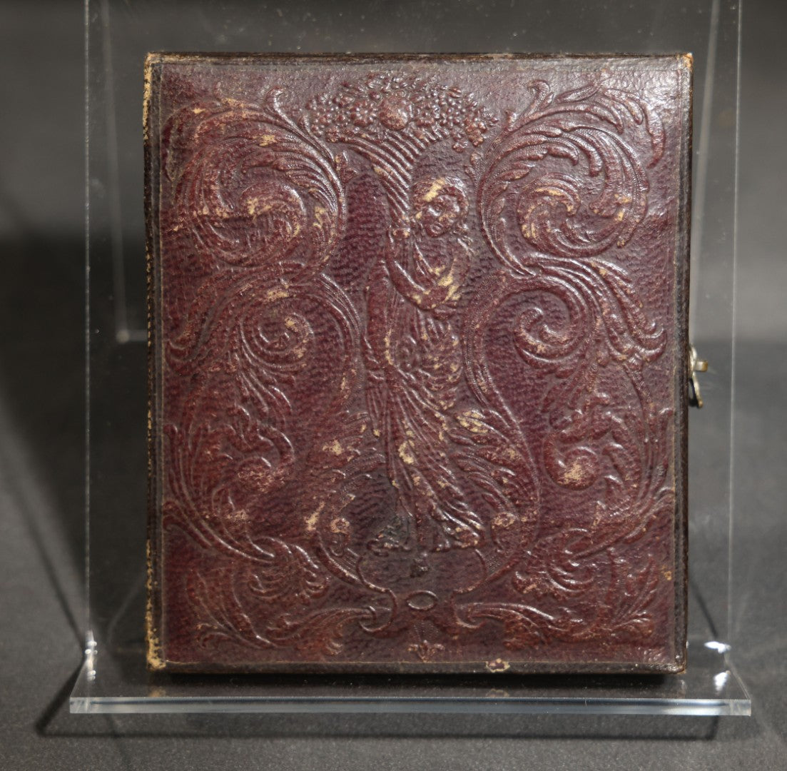 Antique 1/6th Plate Daguerreotype Photograph of a Young Man Hugging His Dog, in Full Leatherette Union Case with Figural Woman and Scrollwork Cover