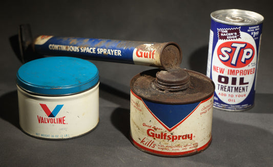 Trio of Vintage Automotive and Household Advertising Tins Including Valvoline Grease Tin, Gulfspray Continuous Space Sprayer Insecticide Canister (16" L), and STP Oil Treatment Can