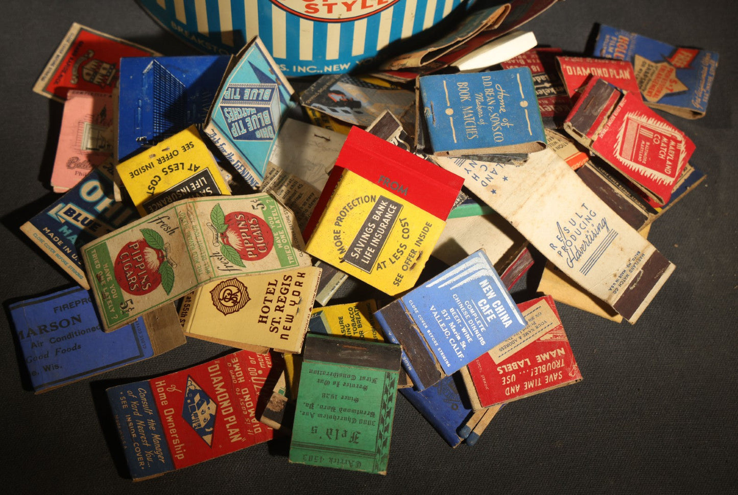Vintage Breakstone Bros. Cottage Cheese Advertising Tin with Discovery Collection of Vintage Advertising Matchbooks Including Hotel St. Regis New York, Pippins Cigars, New China Cafe Vallejo California, and Others