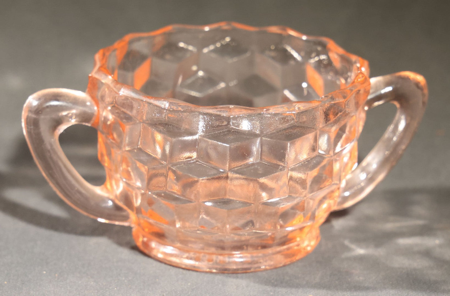 Trio of Vintage Pink Depression Glass Including Floral Relief Creamer, Cubist Open Sugar, and Etched Champagne Coupe