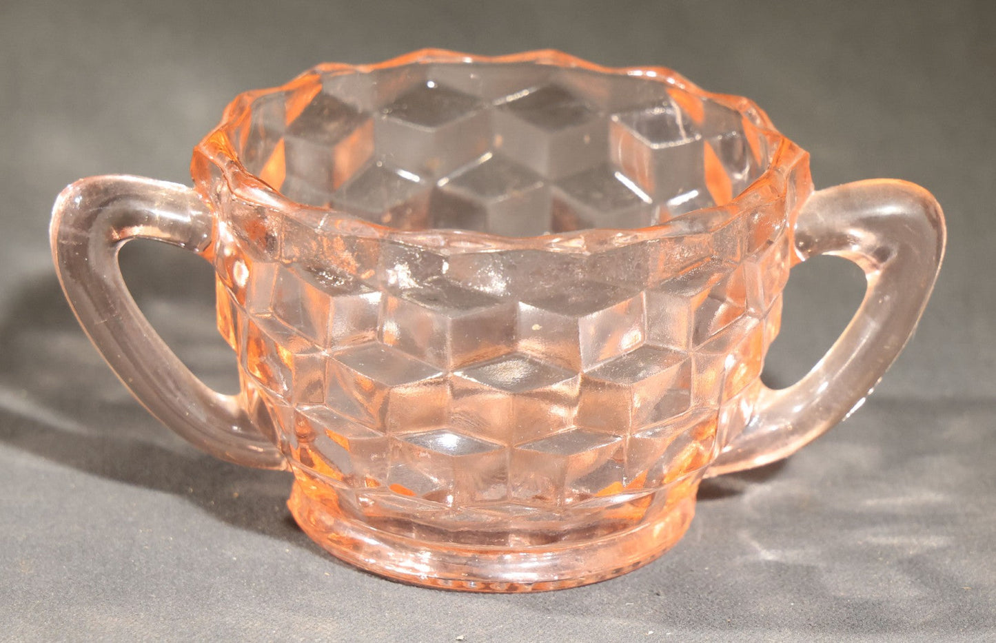 Trio of Vintage Pink Depression Glass Including Floral Relief Creamer, Cubist Open Sugar, and Etched Champagne Coupe