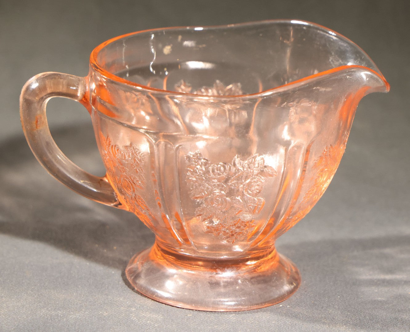 Trio of Vintage Pink Depression Glass Including Floral Relief Creamer, Cubist Open Sugar, and Etched Champagne Coupe