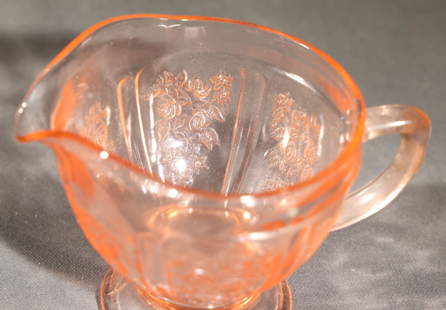 Trio of Vintage Pink Depression Glass Including Floral Relief Creamer, Cubist Open Sugar, and Etched Champagne Coupe