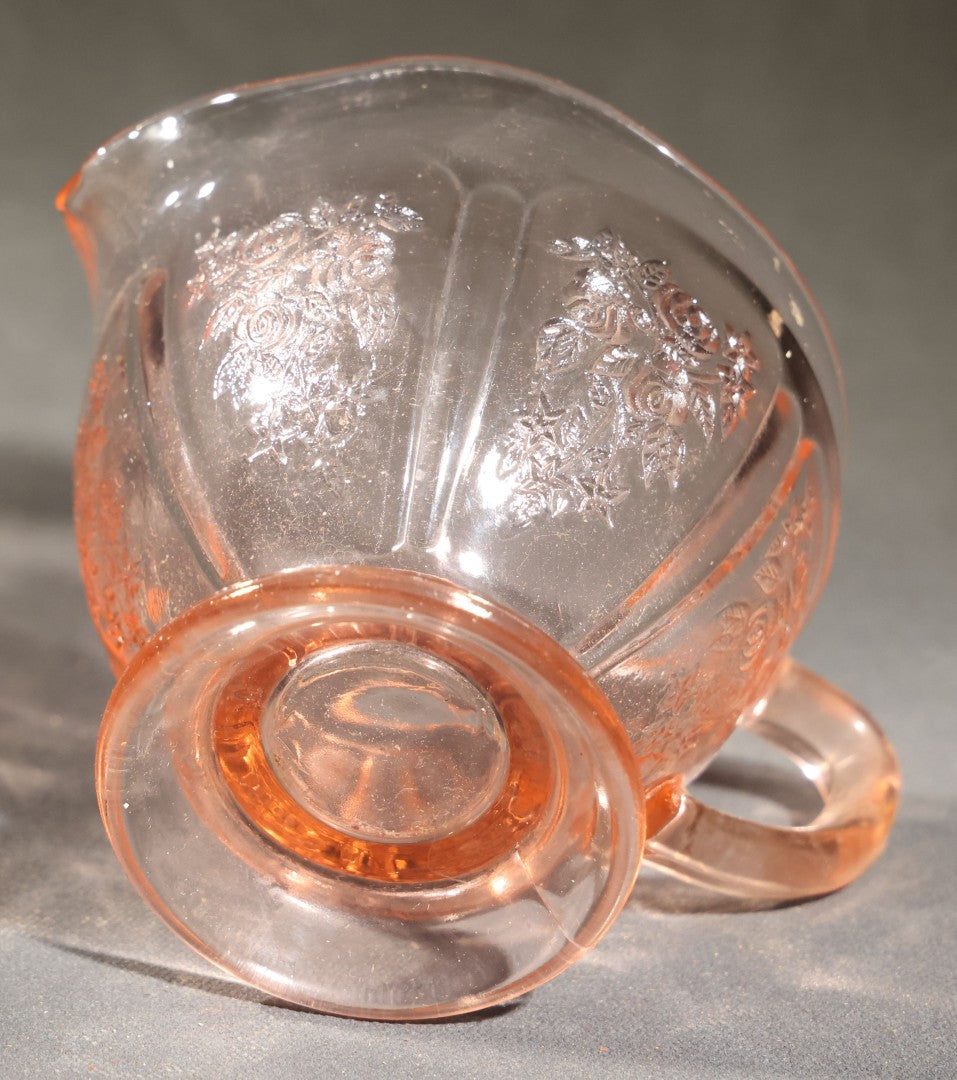 Trio of Vintage Pink Depression Glass Including Floral Relief Creamer, Cubist Open Sugar, and Etched Champagne Coupe