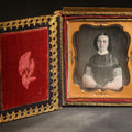 Lot 090 - Antique 1/6th Plate Daguerreotype Photograph of a Young Woman with Ringlet Curls, Photographed by Smith, Rochester, New York, in Papier-MâChé Case with Mother-Of-Pearl Inlay and Rose Decoration