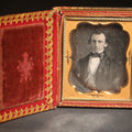 Lot 091 - Antique 1/6th Plate Daguerreotype Photograph of a Middle-Aged Man, Photographed by Smith, Rochester, New York, in Papier-MâChé Case with Mother-Of-Pearl Inlay and Rose Decoration