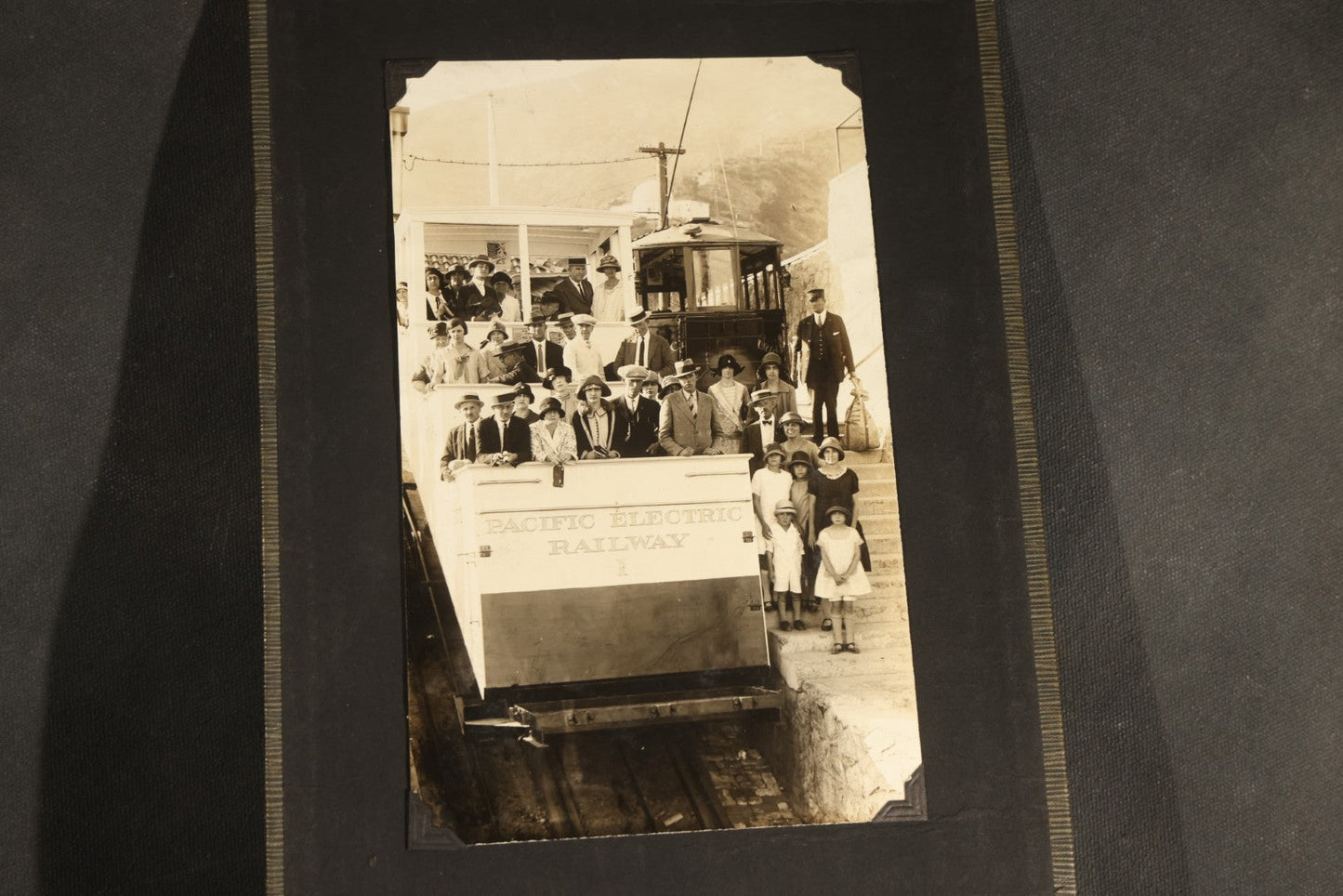 Antique Snapshot Album, Circa WWI Era, 200+ Photographs Including Police Officer on Indian Motorcycle, Pacific Electric Railway, Railroad and Trolley Workers, Woman in Navy Sailor Outfit with Gas Mask, and Beach Scenes