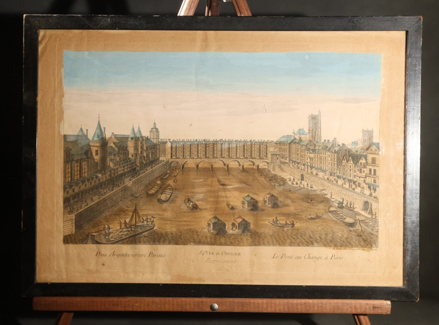 Antique Hand-Colored Engraving Print, Vue D'optique, "Le Pont Au Change a Paris" / "Pons Argentariorum Parisus" ("Bridge of the Money-Changers, Paris"), Published by Daumont, Paris, 18th Century, in Ebonized Frame