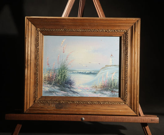 Vintage Decorator Oil Painting on Canvas Panel, Coastal Landscape with Lighthouse and Sea Grass, Indistinctly Signed, in Rope-Twist Wood Frame
