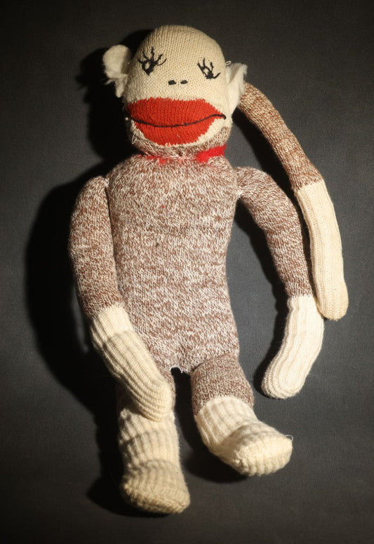 Vintage Sock Monkey Stuffed Toy with Embroidered Features and Red Mouth
