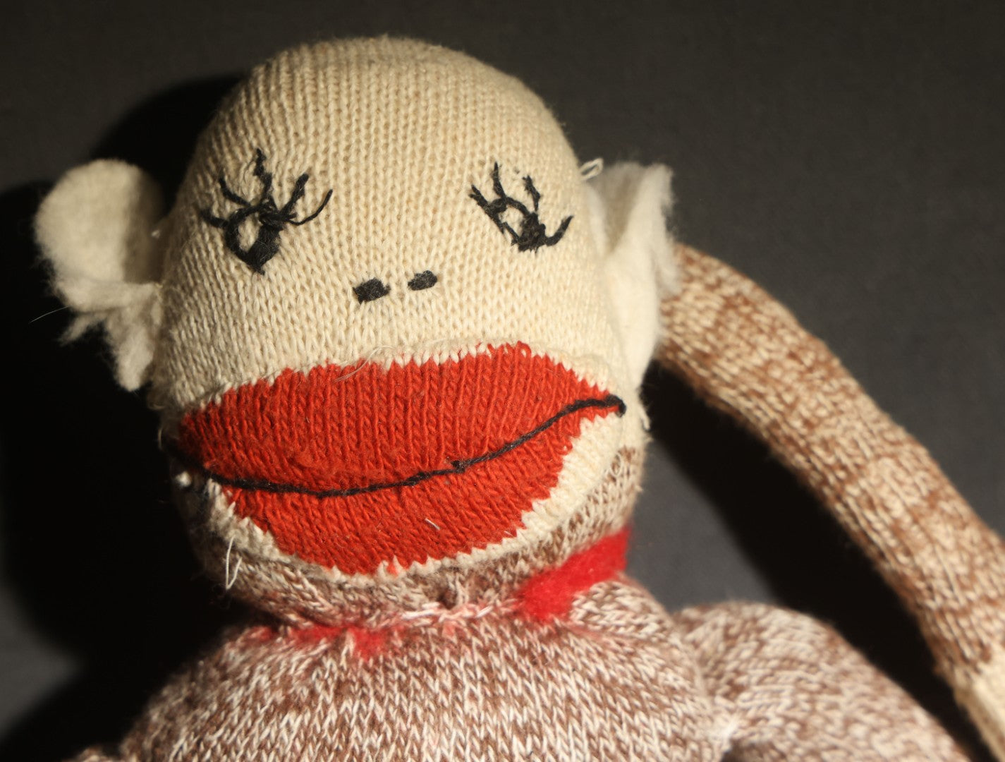 Vintage Sock Monkey Stuffed Toy with Embroidered Features and Red Mouth